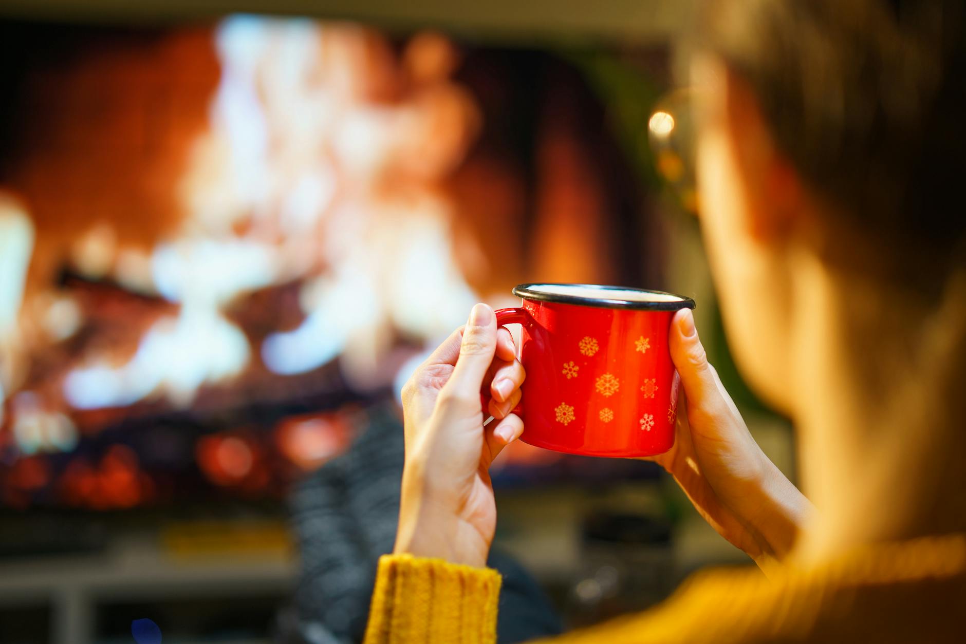 A relaxing winter evening with a warm drink by the fireplace. Perfect for cozy indoor moments.